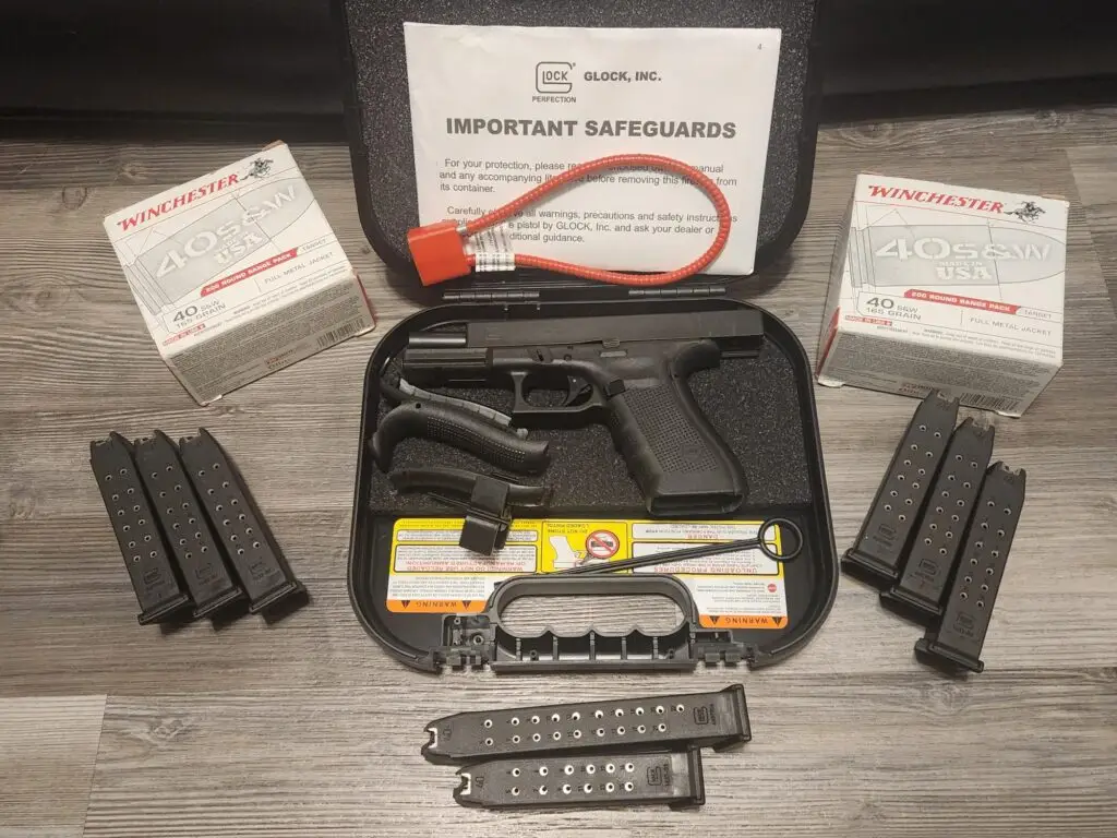 Glock handgun with extra magazines and ammunition box for FFL transfer at Tri-State Training LLC
